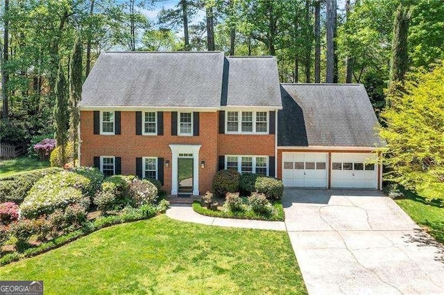 2830 Scottish Mill Way, Marietta, GA 30068 - colonial-style house with an attached garage, driveway, a front lawn, and brick siding