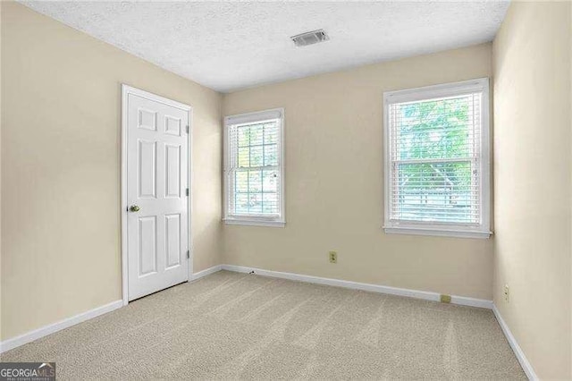 2830 Scottish Mill Way, Marietta, GA 30068 - empty room featuring light colored carpet and a textured ceiling