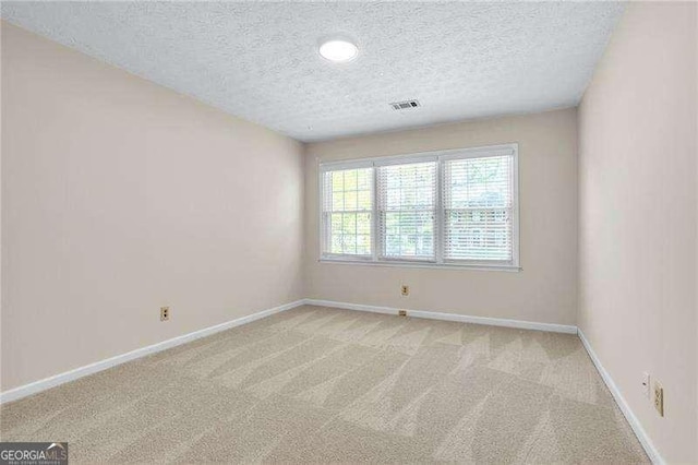 2830 Scottish Mill Way, Marietta, GA 30068 - unfurnished room with a textured ceiling and light colored carpet