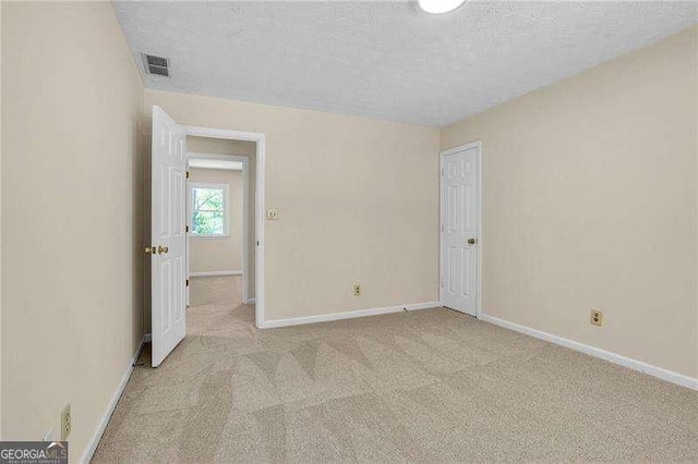 2830 Scottish Mill Way, Marietta, GA 30068 - spare room featuring light carpet and a textured ceiling