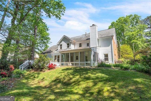 2830 Scottish Mill Way, Marietta, GA 30068 - back of house with a sunroom, a lawn, and a chimney