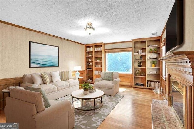 2830 Scottish Mill Way, Marietta, GA 30068 - living area with wood finished floors, ornamental molding, and a fireplace with flush hearth