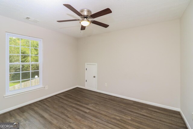 183 Arrowhead Dr, Dallas, GA 30132 - unfurnished room featuring dark wood-type flooring and ceiling fan
