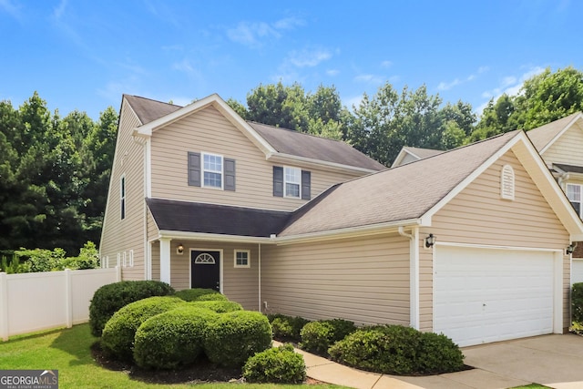 183 Arrowhead Dr, Dallas, GA 30132 - traditional-style house with an attached garage, driveway, and roof with shingles