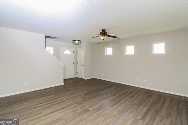 183 Arrowhead Dr, Dallas, GA 30132 - unfurnished living room featuring a ceiling fan and wood finished floors