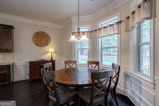 1221 Deer Trl, Bishop, GA 30621 - dining area with healthy amount of natural light, crown molding, a decorative wall, dark wood-style floors, and wainscoting