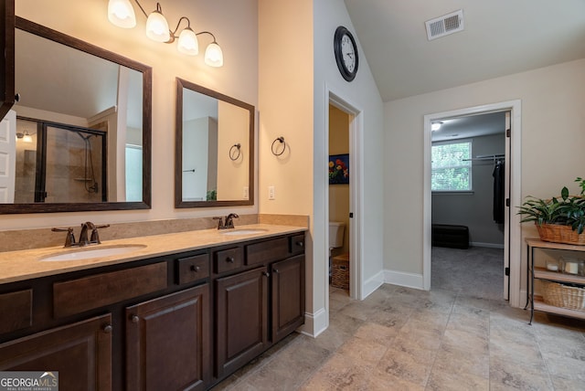 1221 Deer Trl, Bishop, GA 30621 - bathroom with lofted ceiling, double vanity, and a stall shower