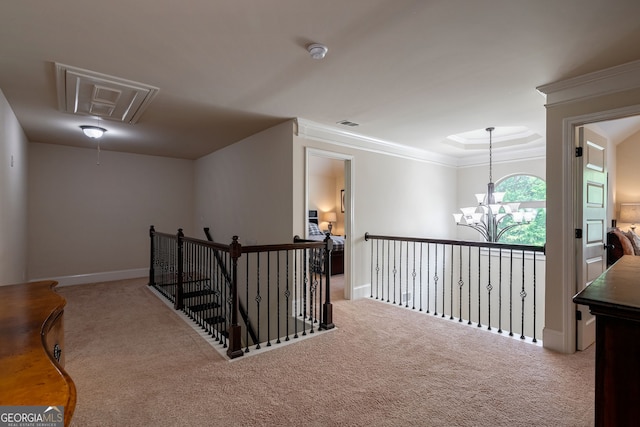 1221 Deer Trl, Bishop, GA 30621 - corridor with carpet flooring, a chandelier, an upstairs landing, ornamental molding, and attic access