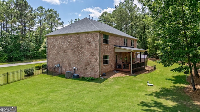 1221 Deer Trl, Bishop, GA 30621 - rear view of property featuring brick siding, a shingled roof, and a deck