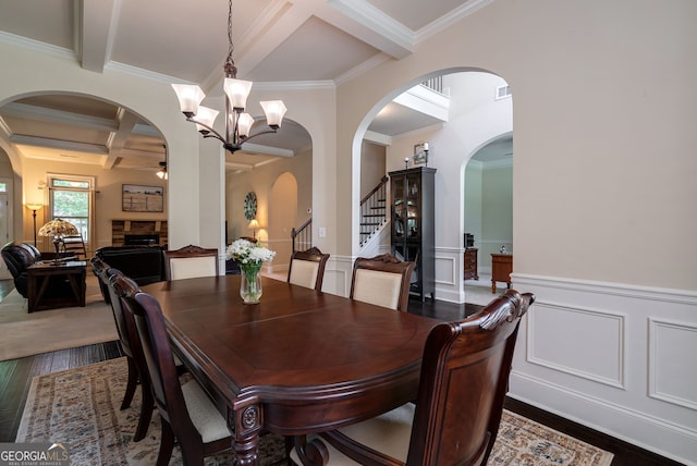 1221 Deer Trl, Bishop, GA 30621 - dining space with arched walkways, coffered ceiling, crown molding, a chandelier, and stairs