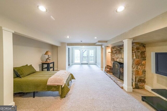 835 Timber Lake Trl, Cumming, GA 30041 - carpeted bedroom featuring recessed lighting, a stone fireplace, and access to exterior