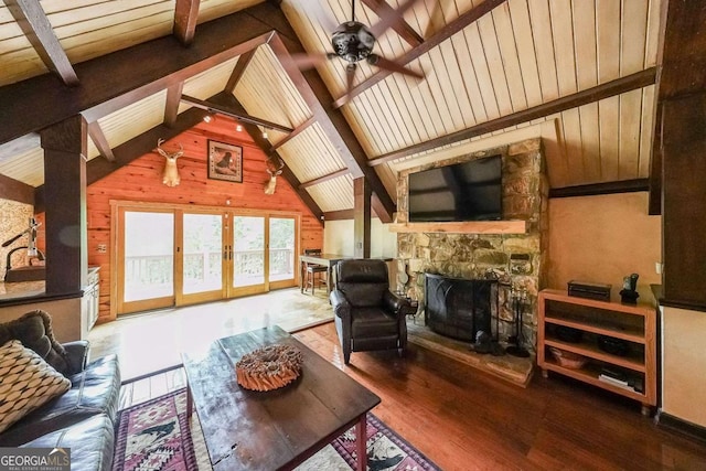 835 Timber Lake Trl, Cumming, GA 30041 - living area with wood finished floors, ceiling fan, a fireplace, wood walls, and french doors
