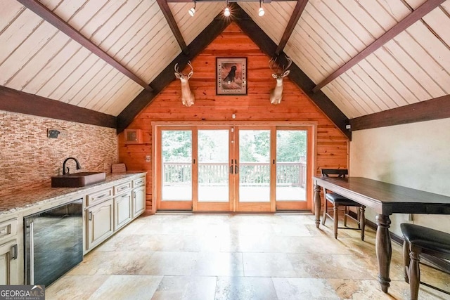 835 Timber Lake Trl, Cumming, GA 30041 - interior space with wooden walls, plenty of natural light, wooden ceiling, french doors, and light stone finish floors