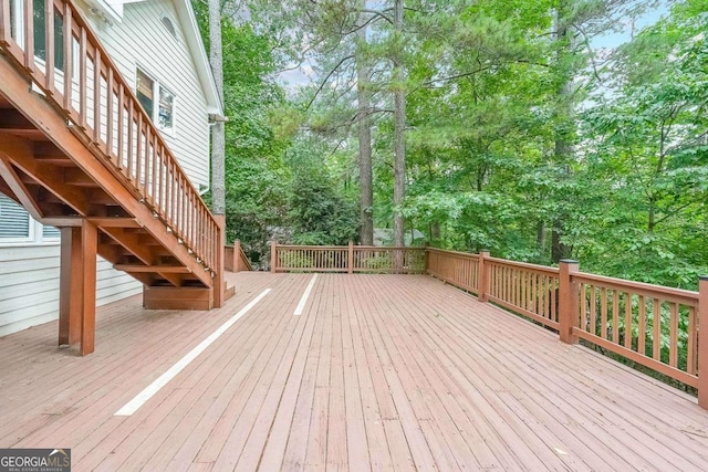 835 Timber Lake Trl, Cumming, GA 30041 - wooden deck with stairway and view of wooded area