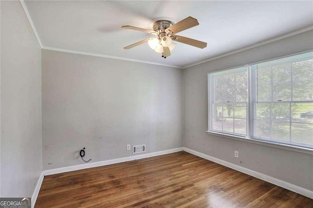 1819 King Alfred Dr SW, Atlanta, GA 30331 - spare room with wood finished floors, ceiling fan, and crown molding
