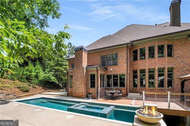 908 Basingstoke Ct, Suwanee, GA 30024 - view of pool with a fire pit, a pool with connected hot tub, and a patio area