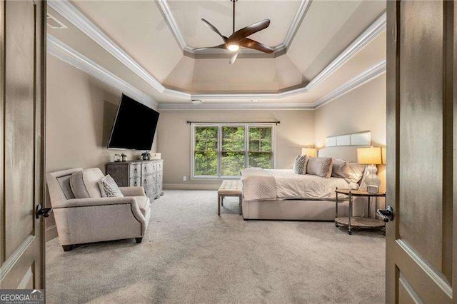 908 Basingstoke Ct, Suwanee, GA 30024 - carpeted bedroom with ornamental molding, a ceiling fan, and a raised ceiling