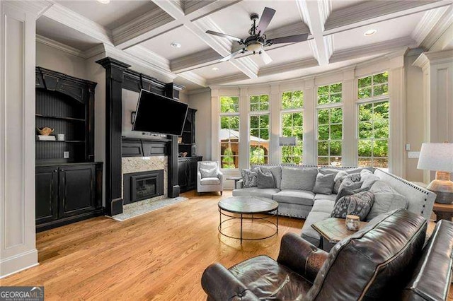 908 Basingstoke Ct, Suwanee, GA 30024 - living room with plenty of natural light, a ceiling fan, light wood-style floors, beam ceiling, and coffered ceiling