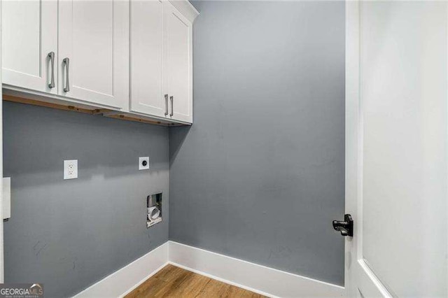 908 Basingstoke Ct, Suwanee, GA 30024 - laundry room with hookup for an electric dryer, cabinet space, washer hookup, and wood finished floors