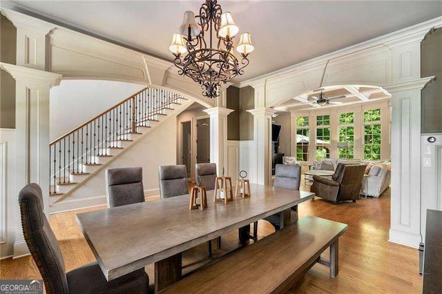 908 Basingstoke Ct, Suwanee, GA 30024 - dining space with ornate columns, a ceiling fan, stairs, wood finished floors, and ornamental molding