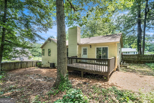 647 Sunshine Trce NW, Acworth, GA 30102 - rear view of house featuring a fenced backyard, a deck, and a chimney