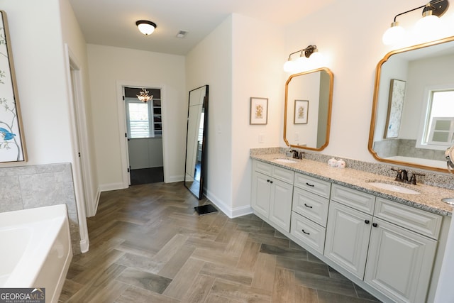 203 Drews Ridge Dr, Newnan, GA 30263 - full bathroom featuring double vanity, a garden tub, and plenty of natural light