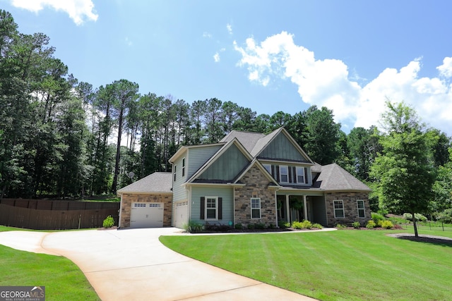203 Drews Ridge Dr, Newnan, GA 30263 - craftsman-style home featuring stone siding, driveway, an attached garage, board and batten siding, and view of wooded area