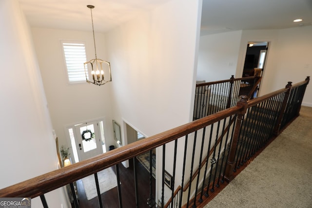 203 Drews Ridge Dr, Newnan, GA 30263 - corridor featuring an upstairs landing, a chandelier, dark carpet, and recessed lighting