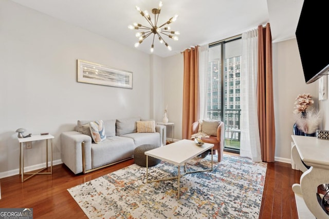 3040 Peachtree Rd NW Unit 702, Atlanta, GA 30305 - living room with a chandelier and wood finished floors