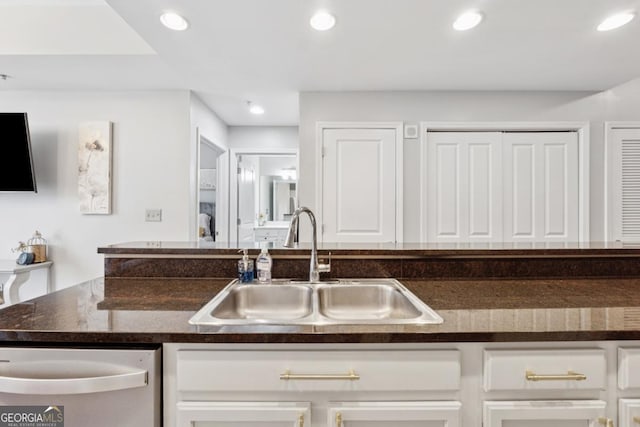 3040 Peachtree Rd NW Unit 702, Atlanta, GA 30305 - kitchen featuring dishwasher, dark countertops, recessed lighting, and white cabinets