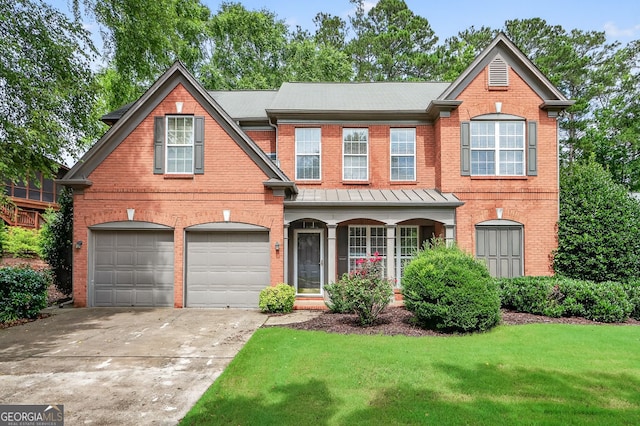 1065 Bookhout Dr, Cumming, GA 30041 - traditional home featuring brick siding, a front lawn, driveway, a porch, and an attached garage