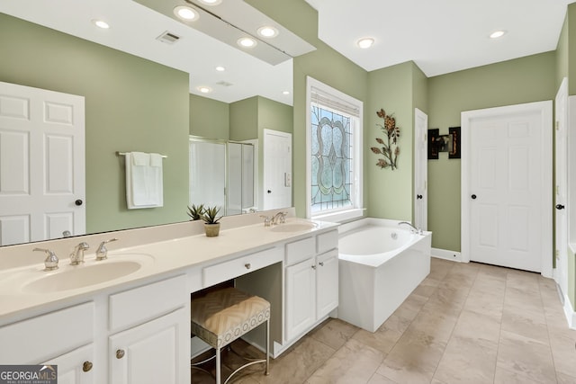 1065 Bookhout Dr, Cumming, GA 30041 - bathroom featuring a garden tub, a shower stall, double vanity, and recessed lighting