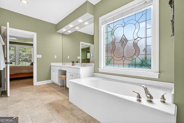 1065 Bookhout Dr, Cumming, GA 30041 - ensuite bathroom featuring double vanity, a bath, and recessed lighting