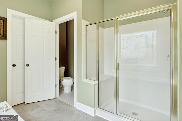 1065 Bookhout Dr, Cumming, GA 30041 - bathroom with a shower stall and toilet