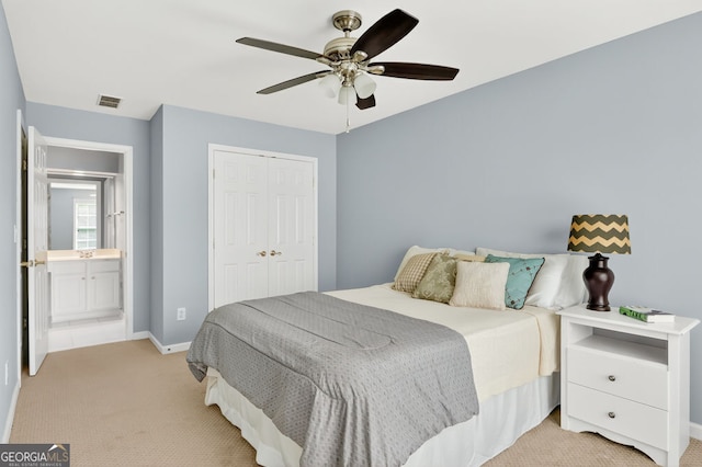 1065 Bookhout Dr, Cumming, GA 30041 - bedroom with light carpet, a closet, and a ceiling fan