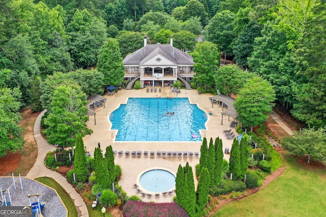 1065 Bookhout Dr, Cumming, GA 30041 - community pool featuring stairway, a deck, and a patio area