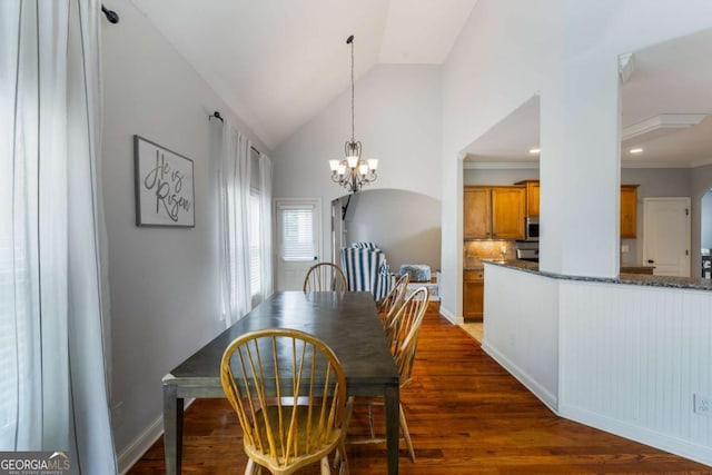 168 Gatlin Ridge Run, Dallas, GA 30157 - dining area with dark wood-style flooring, lofted ceiling, and a chandelier
