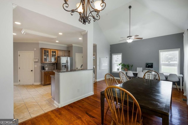 168 Gatlin Ridge Run, Dallas, GA 30157 - dining room featuring healthy amount of natural light, a ceiling fan, high vaulted ceiling, ornamental molding, and light wood-type flooring