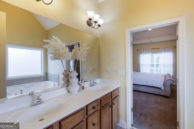 168 Gatlin Ridge Run, Dallas, GA 30157 - ensuite bathroom featuring double vanity, lofted ceiling, and a garden tub