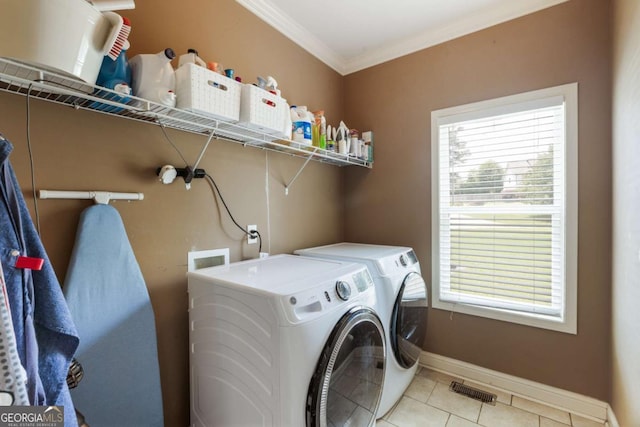 168 Gatlin Ridge Run, Dallas, GA 30157 - laundry room featuring washer and dryer, light tile patterned floors, and crown molding