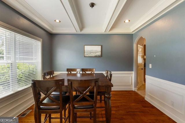 168 Gatlin Ridge Run, Dallas, GA 30157 - dining space featuring arched walkways, a wainscoted wall, beam ceiling, ornamental molding, and wood finished floors