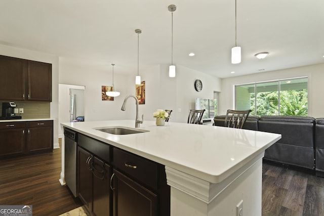 80 Rimmon Ct, Richmond Hill, GA 31324 - kitchen featuring dark wood finished floors, dishwasher, light countertops, open floor plan, and dark brown cabinets