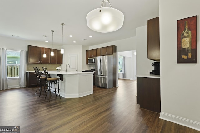 80 Rimmon Ct, Richmond Hill, GA 31324 - kitchen with appliances with stainless steel finishes, dark wood-type flooring, light countertops, dark brown cabinets, and recessed lighting