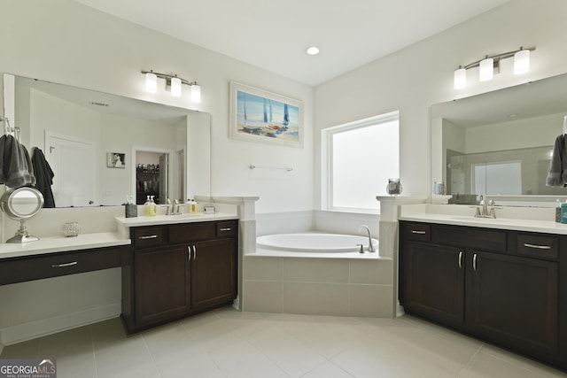 80 Rimmon Ct, Richmond Hill, GA 31324 - full bathroom featuring two vanities, a bath, tile patterned floors, and walk in shower