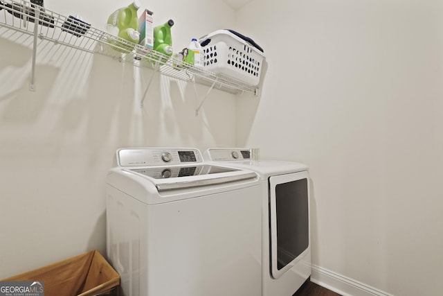 80 Rimmon Ct, Richmond Hill, GA 31324 - washroom featuring washer and dryer and dark wood-type flooring