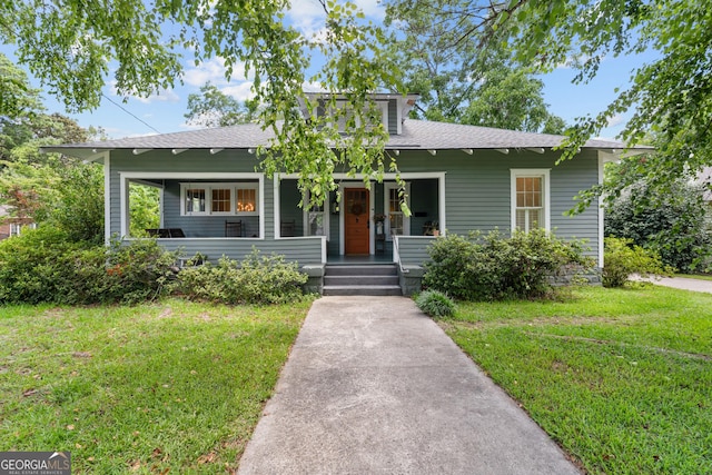 110 College Blvd, Statesboro, GA 30458 - bungalow-style home with a porch, roof with shingles, and a front yard