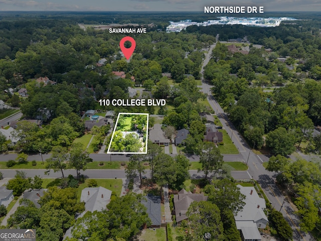 110 College Blvd, Statesboro, GA 30458 - aerial view of residential area with property parcel outlined and a heavily wooded area