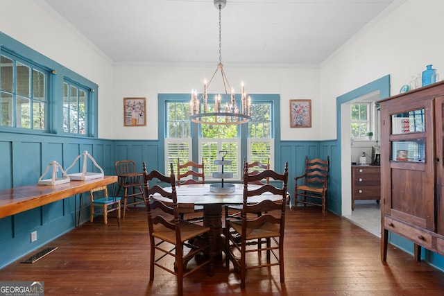 110 College Blvd, Statesboro, GA 30458 - dining room with a chandelier, plenty of natural light, wainscoting, dark wood-type flooring, and ornamental molding