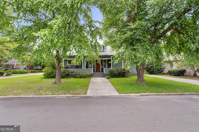 110 College Blvd, Statesboro, GA 30458 - view of property hidden behind natural elements featuring a front lawn and covered porch