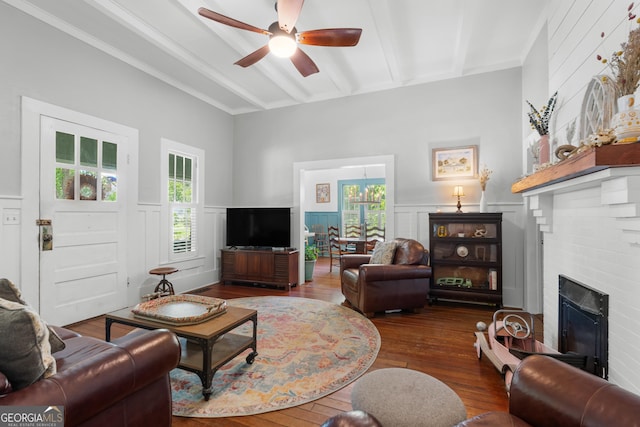 110 College Blvd, Statesboro, GA 30458 - living area with a ceiling fan, a decorative wall, hardwood / wood-style floors, a fireplace, and wainscoting
